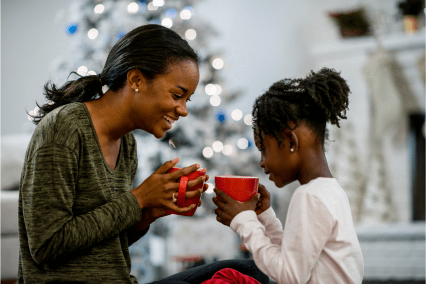 mom and daughter drinking hot chocolate