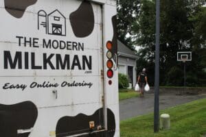 milk delivery truck at a house