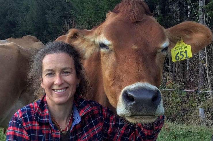 Amy Richardson posing with brown cow