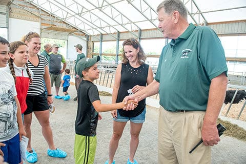 Bill Rowell shaking hands