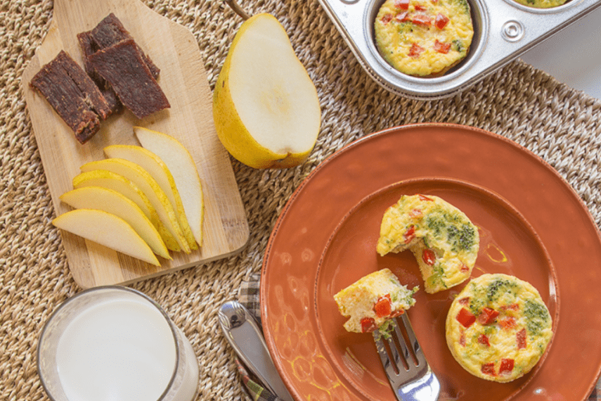 Broccoli frittatas on place with fruit