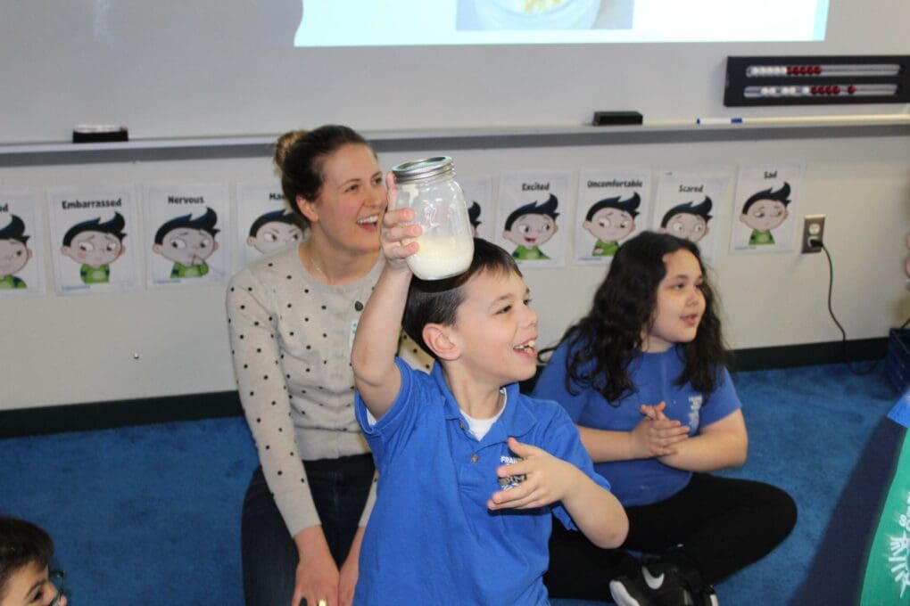 kids learning how to make butter