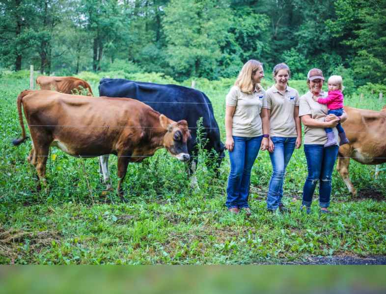 farm family in cow pasture