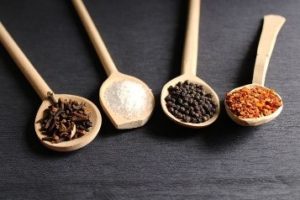 Four spoons with spices