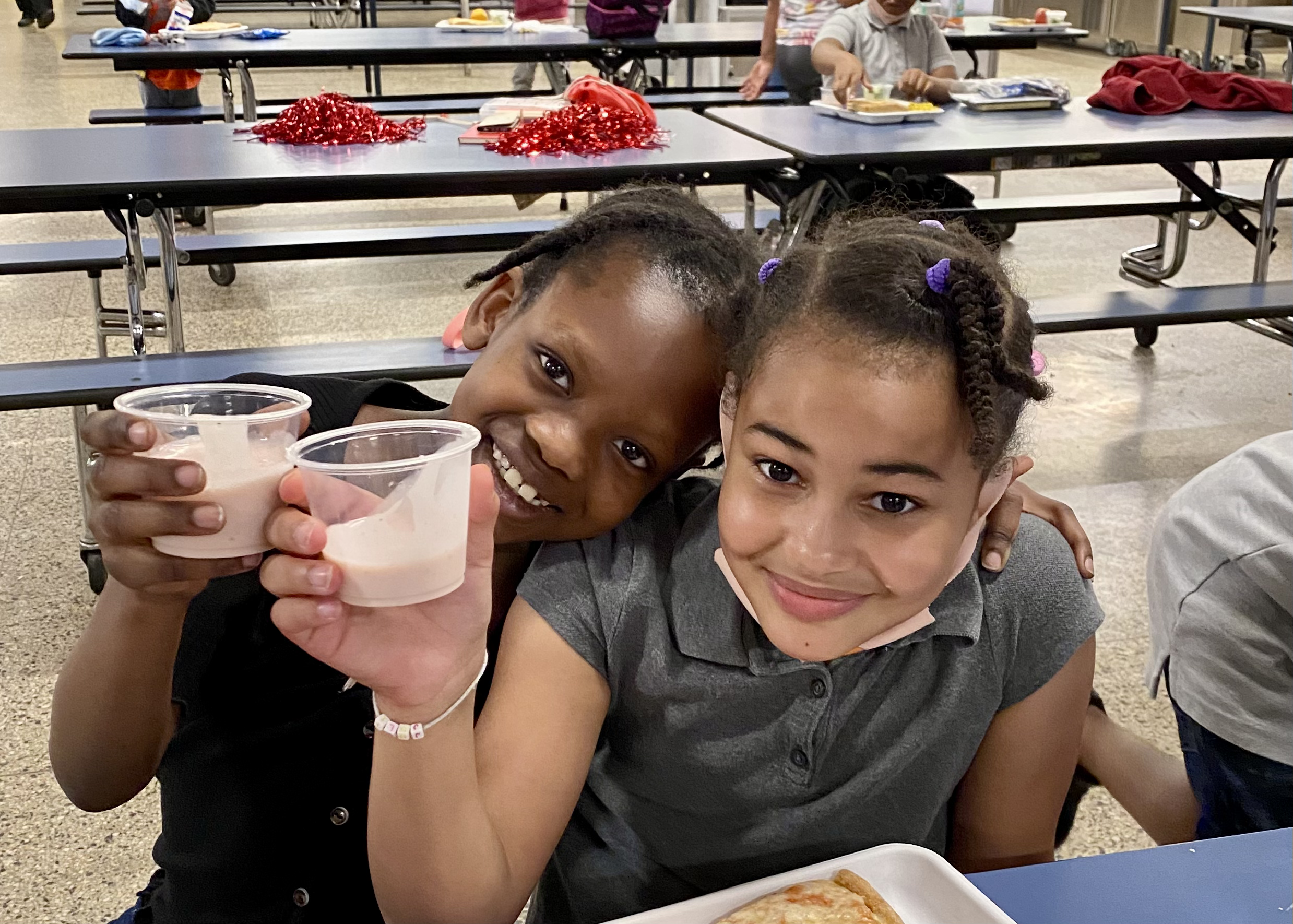 elementary school students drinking smoothie samples