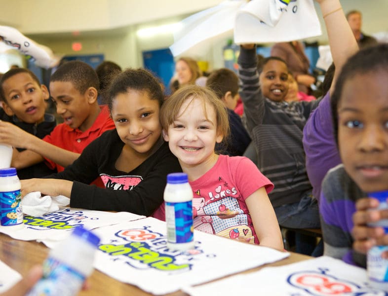 Kids smiling with milk