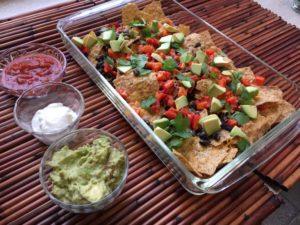 Tray of nachos with 3 dips for Sunday's big game