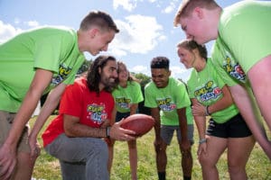 Nate Ebner huddled with FUTP60 Student Ambassadors