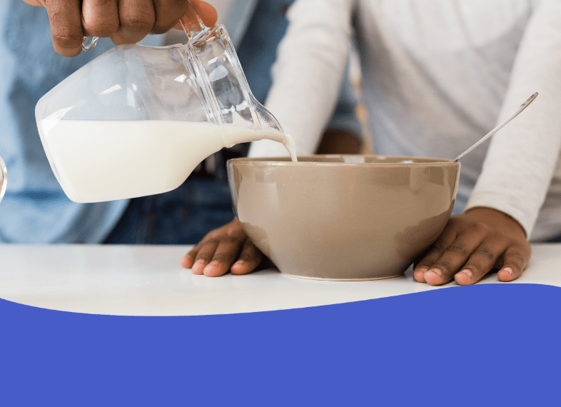 Milk pour into cereal bowl