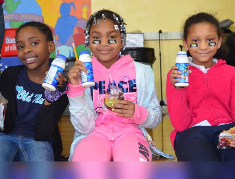 kids at school drinking milk