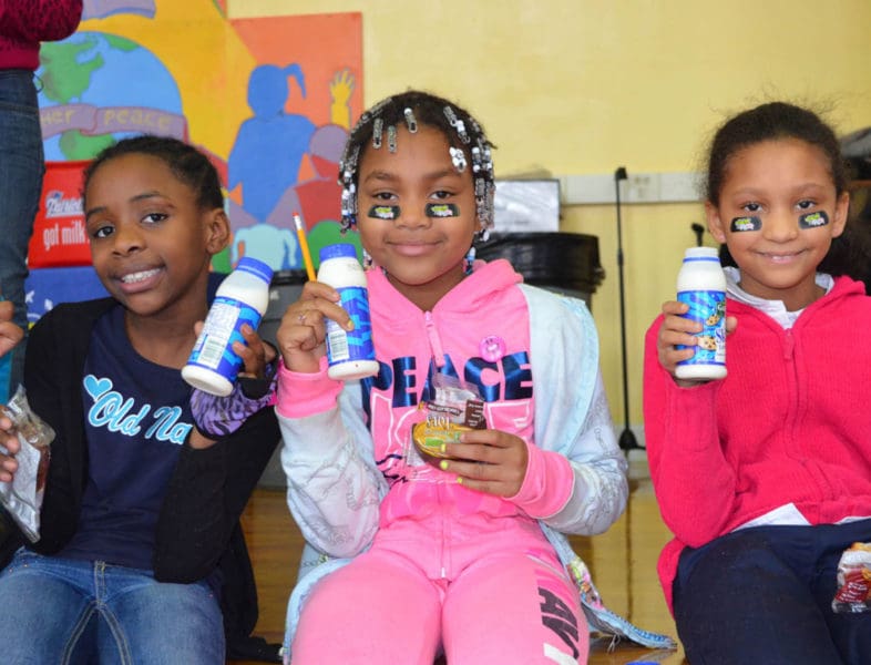 young kids drinking milk